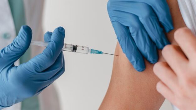 doctor-with-gloves-vaccinating-patient